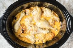 the chicken is in the slow cooker ready to be cooked and put into the oven