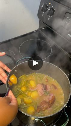 a person cooking food in a pot on the stove