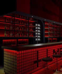 a dimly lit bar with stools and red lights on the walls, along with shelves full of liquor bottles