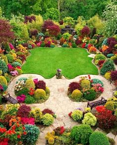 an aerial view of a garden with lots of colorful flowers and plants in the center