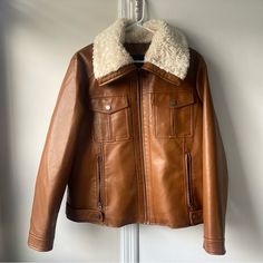 I'm Selling A Brand New Brown Leather Jacket With White Fur Trim, Button-Up And Zipper, Plus A Stylish Collar. Ships In 1-3 Business Days. I Would Pair With Jeans And Boots Or A Dress And Ankle Boots! Casual Winter Leather Jacket With Buttons, Casual Leather Jacket With Buttons For Winter, Casual Winter Leather Jacket With Button Closure, Casual Leather Jacket With Button Closure For Winter, Winter Collared Leather Jacket With Snap Buttons, Collared Leather Jacket With Snap Buttons For Winter, Classic Winter Outerwear With Button Zip Fly, Casual Leather Jacket With Snap Buttons For Winter, Trendy Winter Leather Jacket With Button Closure