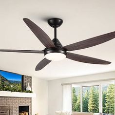 a living room with a couch and a ceiling fan in it's centerpiece