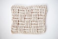 a crochet square is shown on a white surface