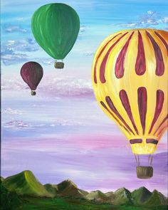 three hot air balloons flying in the sky