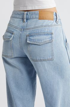 Make a statement in Y2K-inspired nonstretch jeans flaunting a low-rise waist, full-length wide legs and trend-right cargo pockets. 33" inseam; 23" leg opening; 10" front rise; 14" back rise (size 29) Zip fly with button closure Front slant pockets; back flap-patch pockets 100% cotton Machine wash, tumble dry Imported Wide-leg Cropped Denim Jeans With Pockets, Denim Blue Straight Leg Bottoms With Flap Pockets, Denim Blue Wide Leg Flare Jeans With Hip Pockets, Relaxed Fit Wide Leg Cropped Jeans With Patch Pockets, Relaxed Fit Flare Jeans With Cargo Pockets, Trendy Relaxed Fit Cropped Jeans With Pockets, Denim Blue Wide-leg Flare Jeans With Pockets, Trendy Mid-rise Flare Jeans With Pockets, Spring Wide Leg Jeans With Flap Pockets