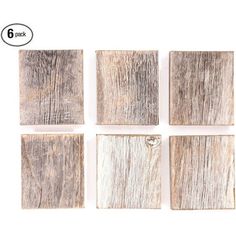 six square wooden tiles with white paint on the top and bottom, all in different sizes