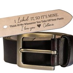 a leather belt with a metal buckle and engraved message on the bottom, which reads i picked it, so it's mine