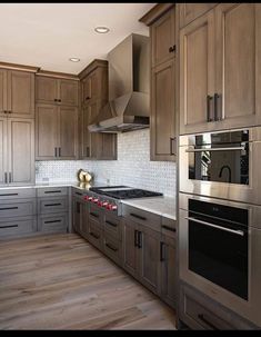 a kitchen with wooden cabinets and stainless steel stove top oven in the center, surrounded by wood flooring