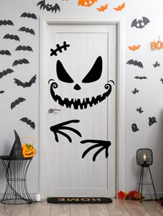 a door decorated with halloween decorations and bats