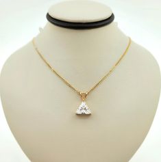 Breathtaking Vintage 1960s Handmade Solid 14K Yellow Gold & Trilliant Cut Cubic Zirconia Necklace. 16" Necklace. Perfect gift for a loved one! Hallmarks: 14K Total necklace weight: 3.4g The darkness on the necklace are reflections. The pendant measures approx: 14.9 mm long with bail and 10.3 mm wide. Will be placed into a suitable gift box Free shipping within the U.S. Larchmont Ny, 16 Necklace, Zirconia Necklace, Cubic Zirconia Necklace, Wedding Jewellery Necklace, The Darkness, Wedding Necklace, Vintage 1960s, Wedding Jewelry