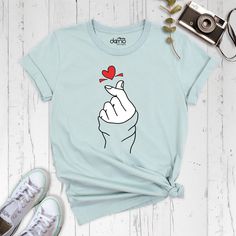 Finger Heart Shirt, Kpop Finger Shirt, Valentine's Day Shirt, Saranghae Shirt, Love Symbol Shirt, Korea Finger Heart Shirt, Korean Lover Tee Our products are Bella+Canvas branded. If Bella+Canvas is out of stock, I will send it from a trusted brand of the same size and quality. You can contact us in case of any problem or request. If you purchase a custom product, I will send you a message to confirm the design, don't forget to check your message box. Your satisfaction is important to us :) Plea Finger Heart, Love Symbol, Shirt Korean, Message Box, Heart Shirt, Valentines Day Shirts, Cute Tshirts, Love Symbols, Neck Shirt