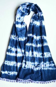 a blue and white tie dyed scarf