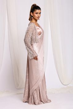 Dusty rose pre-draped saree in pleated fabric base. Comes with intricate cutdana tassel embroidered jacket and padded blouse. - Aza Fashions Semi-stitched Draped Blouse Piece For Eid, Elegant Draped Unstitched Saree, Semi-stitched Draped Saree For Evening, Traditional Drape Pre-draped Saree For Eid Evening, Evening Eid Pre-draped Saree With Traditional Drape, Evening Pre-draped Traditional Saree For Eid, Party Saree For Eid, Draped Style, Eid Evening Pre-draped Traditional Saree, Eid Party Draped Saree