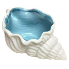 a blue and white ceramic bowl sitting on top of a table