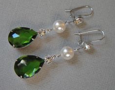 Emerald Green Earrings Long Dangle Pear Shape Rhinestone and a Swarovski Pearl wedding bridal St Patrick's Day jewelry These Bridal Earrings in Emerald Green Crystal Rhinestone are so pretty with a Long Green Pear Shaped Drop that measures a total of 2 1/2 inches long. Made with a Swarovski Pearl in your choice of color either White (shown) or Cream Ivory, these also have a French hook with sparkling Rhinestone on the top. Comes in a Gift Box and ready to give. Perfect wedding bridal or gift! To Green Crystal Bridal Earrings For Wedding, Elegant Green Crystal Earrings For Weddings, Green Crystal Rhinestone Earrings For Wedding, Green Rhinestone Crystal Earrings For Wedding, Wedding Green Crystal Rhinestone Earrings, Emerald Green Crystal, Emerald Green Earrings, Green Crystal, Pearl Wedding