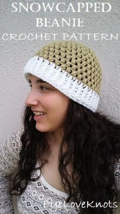 a woman wearing a crocheted hat with the words snowcapped beanie on it