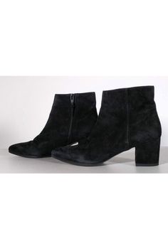 Stylish ankle booties made in luxe suede. They feature a chic pointed toe and classic blocked heel. Perfect to wear with a sweater dress and tights. Size 6.5 M Suede upper Leather lining Manmade sole Made in Spain Stacked heel Side zippers Light wear on soles Some wear/marks on suede Heel height 2.25" Chic Low Heel Boots For Fall, Chic Low Heeled Boots For Fall, Chic Winter Booties With Reinforced Heel, Pointed Toe Suede Boots For Winter, Ankle-high Suede Booties For Winter, Pointed Toe Booties With Reinforced Heel For Winter, Winter Pointed Toe Booties With Reinforced Heel, Low Heel Medium Width Heeled Boots For Fall, High Ankle Suede Booties For Fall