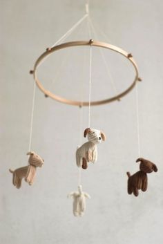 an animal mobile is hanging from the ceiling