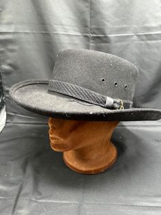 Vintage J-hats Americana Collection Western Wool Felt Flat Top Cowboy Hat Large Add some Western flare to your outfit with this vintage J-hats Americana Collection cowboy hat. Crafted with 100% wool, this black hat is perfect for any occasion, from rodeos to concerts. The flat top design adds a unique touch to the classic western style, making it a standout piece in your collection. The hat is from the 1980s, adding to its vintage charm. It's a large size, making it a comfortable fit for everyon Western Brimmed Hat For Kentucky Derby, Vintage Adjustable Hats For Country Events, Vintage Fedora Hat For Outdoor, Western Style Boater Hat With Short Brim For Winter, Western Style Winter Boater Hat With Short Brim, Kentucky Derby Top Hat For Ranch Events, Vintage Flat Brim Fedora For Outdoor, Western Style Short Brim Boater Hat For Winter, Vintage Black Top Hat For Western-themed Events