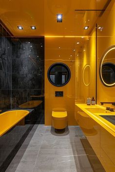 a bathroom with yellow and black walls, two sinks and a bathtub in the middle