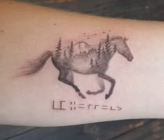 a tattoo with a horse and trees on it's arm that reads, eifffel