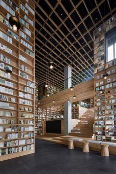 an empty library with wooden shelves and benches