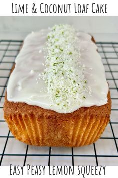 a close up of a cake on a cooling rack with the words lime and coconut loaf cake