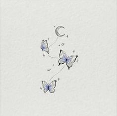 two butterflies flying in the sky with crescents and stars on their wings, one is blue