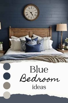 a blue bedroom with white and gray bedding, pillows and throw pillows on the bed