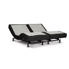 an adjustable bed frame with black and white fabric