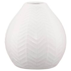 a white vase with wavy lines on the bottom is shown in front of a white background