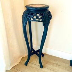 a small black table with a glass top