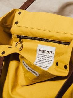 Strong leather handles add extra polish to this casual cotton canvas tote bag in a fun mustard yellow hue. Handcrafted with 100% organic cotton canvas and handles from the finest eco-friendly, vegetable tanned, biodegradable leather. Features a large zippered inner pocket and a large open main compartment for easy access to all your goodies! Yellow Everyday Canvas Tote Bag, Yellow Cotton Tote Bag, Eco-friendly Yellow Canvas Bag, Eco-friendly Yellow Tote Beach Bag, Eco-friendly Yellow Tote Bag, Poverty In India, Yellow Tote Bag, Open Main, Changing Jobs