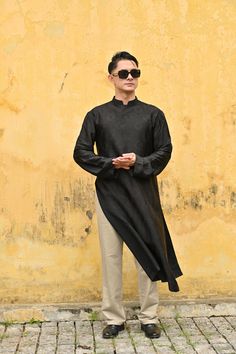 If you are looking for a featured traditional Vietnamese outfit for men, our silk ao dai is an option not to be missed! The ao dai/tunic  is made from high-quality mulberry silk woven and hand-dyed in a hundred-year-old Vietnamese craft village, with typical motifs of Vietnamese culture. You can choose between a simple, modern style and a more traditional costume. The ao Dai is hand-tailored according to your measurements and wishes, with many color options. ✓DETAILS - Handmade mulberry silk, li Vietnamese Men Fashion, Modern Ao Dai Fashion Street Styles, Traditional Long Sleeve Ao Dai For Formal Occasions, Black Traditional Kurta With Stand Collar, Fitted Black Spring Kurta, Traditional Black Kurta For Spring, Formal Black Silk Kurta, Long Black Kurta For Formal Occasions, Elegant Stand Collar Kurta For Spring