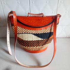 "Sisal bag,leather bag,African bag,sling bag,African purse,crossbody bag, These bags were traditionally used by women for carrying food from the garden. It is handwoven by Kikuyu and kamba women. This bag can be for everyday use . Perfect christmas gift for loved ones from JayAfribeads. Material: leather ,sisal and wool. It's 8\" wide ×10 tall. Ship via dhl express. Thank you for visiting." African Bag, Woven Leather Bag, Basket Tote, Handmade Sandals, Unique Mothers Day Gifts, Beaded Sandals, Handcrafted Bags, Woven Tote Bag, Leather Finish