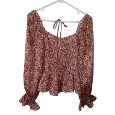 Add Some Bohemian Flair To Your Wardrobe With This Lucy Paris Blouse. The Multicolor Floral Pattern Adds A Pop Of Color To Any Outfit, While The Boat Neckline And Tie In The Back Give It A Unique And Feminine Touch. The Classic Fit And Long Sleeves Make It Perfect For Any Occasion, And It's Machine Washable For Easy Care. This Blouse Is Brand New With Tags And Made From 100% Polyester, Ensuring Quality And Durability. 100% Polyester Red Long Sleeve Peasant Top With Floral Print, Long Sleeve Red Peasant Top With Floral Print, Red Long Sleeve Blouse For Vacation, Red Floral Print Peasant Top For Fall, Flowy Peasant Top With Floral Print, Red Bohemian Peasant Top For Fall, Fall Vacation Blouse With Smocked Bodice, Fall Floral Print Red Peasant Top, Bohemian Red Peasant Top For Fall