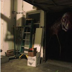 an image of a dog in the garage with his head sticking out from under the garage door