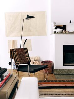 a living room filled with furniture and a fire place