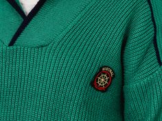 "DESCRIPTION/DETAILS - vintage green men's preppy sweater with the patch in a marine style on the chest - material: no label CONDITION (1-10 ❶❷❸❹❺❻❼❽❾ Great vintage condition The sweater was brought to the best possible condition. The sweater is washed and ready to wear. SIZE/MEASUREMENTS size from label: no label best fits men: L/XL chest: 55 inches (140 cm) length: 26,5 inches (67 cm) sleeve length from armpit: 20,5 inches (52 cm) The model is 6'3\" (190 cm), measures 45-36-43,5 (114-92-110 cm Retro Green Knitted Sweater, Retro Green Crew Neck Sweater, Green Knitted Sweater Mens, Men’s Vintage Sweaters, Vintage Green Crew Sweater, Sweater Preppy, Mens Sweaters, Preppy Sweater, Fits Men