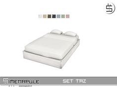 the bed is made up with white sheets and pillows on top of it, as well as four different colors