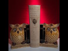 an owl bookend with three books in front of it