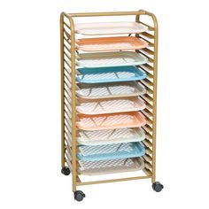 a gold rack with six trays on wheels and four different colored plates in it