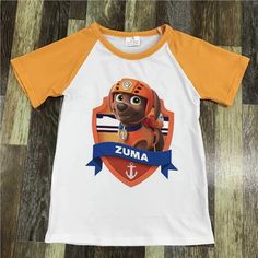 Ready to ship. Made of cotton and spandex. Please allow 2-4 weeks for shipping Paw Patrol Zuma, Paw Patrol Shirt, Zuma Paw Patrol, Raglan Shirts, Shirt Sale, Paw Patrol, Spandex, Boutique, Mens Graphic Tshirt