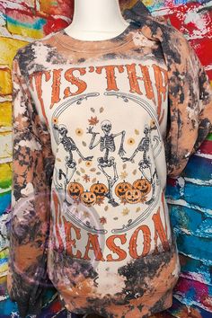 Fall Bleached Sweatshirt, Tis The Season Halloween Skellies, Pumpkin, Fall Leaves, Cow Bleached Sweatshirt, Autumn Crewneck, Sweater Weather -Polyester/cotton blend (Unisex Sizing) -Heather grey -Gildan Brand  -Every shirt will vary how they bleach. Which makes each one unique and special 😊 -Hand Bleached -Sublimation print -My current processing time for orders that will be shipped is 7-10 Business days! There are times where a certain shirt color is sold out and I am unable to get it, if this Soft-washed Acid Wash Tops For Fall, Fall Skull Print Crew Neck Top, Spooky Skull Print Fall Top, Fall Skull Print Long Sleeve T-shirt, Spooky Skull Print Top For Fall, Spooky Skull Print Tops For Fall, Long Sleeve Skull Print T-shirt For Fall, Grunge Skull Tops For Fall, Horror Long Sleeve T-shirt For Fall