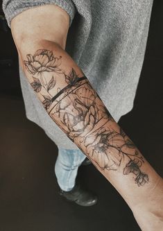 a person with a flower tattoo on their arm