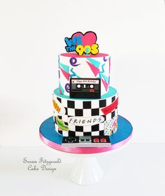 a three tiered cake decorated with an old school cassette player and the words friends on it