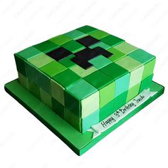 a birthday cake made to look like a minecraft creeper