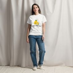 This fun graphic t-shirt with the saying, "Make Lemonade" is a nod to the saying "when life gives you lemons, make lemonade"...simple, bright and printed on a Men's Shirt so it will be OVERSIZED for women and fit accordingly for men.   Personally I have this, as a woman, in a Medium, I am 5'2, 150lbs and I can wear with leggings or biker shorts and love it! The 100% cotton men's classic tee will help you land a more structured look. It sits nicely, maintains sharp lines around the edges, and goe Lemon Graphic, Make Lemonade, Gift For Woman, Layered Streetwear, Streetwear Outfits, Fun Summer, Look Plus, Biker Shorts, Haiti