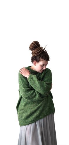 Hand-knitted green long, voluminous raglan sweater. Dimensions: Chest circumference - 140 cm Length to neck - 72 cm Sleeve length from shouder - 73 cm Weight of the sweater - 481g Model size is EU L/XL and height 175 cm. Material: 25%kid mohair,  25%polyamide 50% natural sheep wool, produced by local Latvian sheeps. The wool was produced in a traditional way in a small family factory. Washed and gently dyed using traditional yarn production technics. This washing method saves a maximum of lanolin. This ensures that the sweater will be very warm.  May be present some pieces of hay or dry grass. No chemicals are used in the production.   A really unique handmade wool accessory. Warm and cozy sweater for a walks in a cold weather. Care: Yarn contains lanolin. Wash by hand or in the washing ma Wool Accessories, Yarn Sweater, Raglan Sweater, Raglan Pullover, Pullover Sweater Women, Small Family, Hand Dyed Yarn, Green Sweater, Sheep Wool