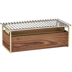 a wooden box with metal bars on top